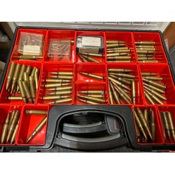 A rare collection of 7.62 x51mm Early NATO Ammunition arranged in a collector case for display and recognition.